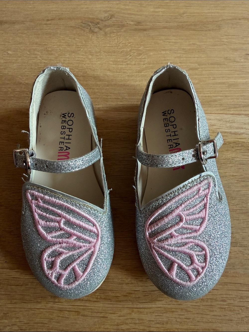 Sophia Webster Mini Butterfly Flat - Glimmer Silver. Size 24
